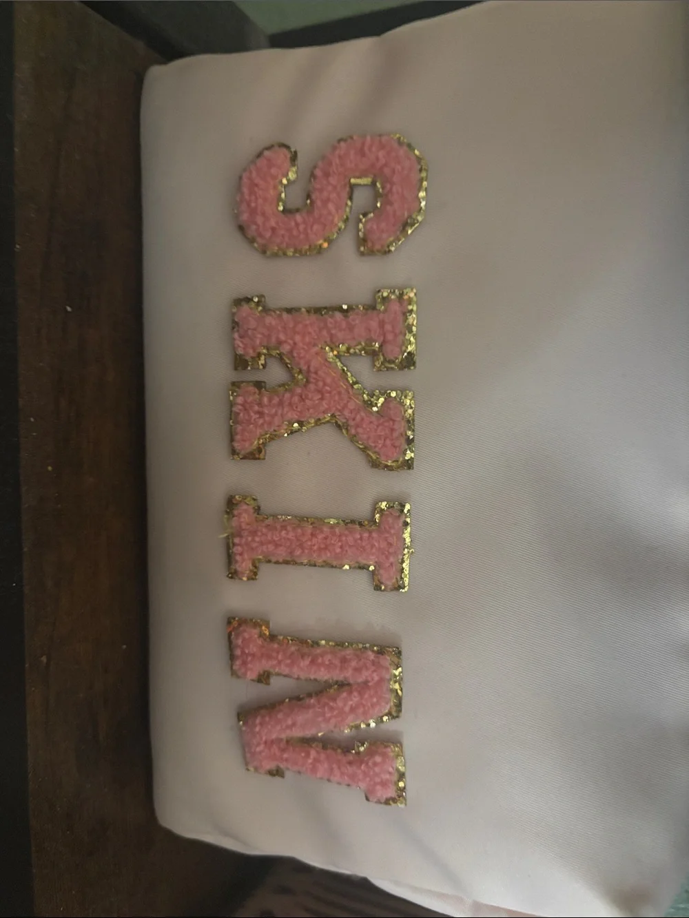 Pink Sparkle 'SKIN' Letter Appliqué cosmetic bag.